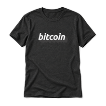 Bitcoin 3D wordmark original artwork on a black heather t-shirt, upright relaxed flatlay on pure white