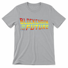 Blockchain Is the Future original artwork on a silver Bella + Canvas 3001 T-shirt, realistic upright flatlay on a white background