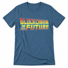 Blockchain Is the Future original artwork on a steel blue Bella + Canvas 3001 T-shirt, realistic upright flatlay on a white background