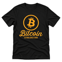 Bitcoin Established 2009 orange graphic on a black t-shirt, upright flatlay on a pure white background