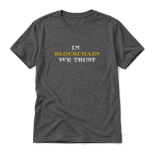 In Blockchain We Trust original artwork on a dark grey heather t-shirt, upright relaxed flatlay on pure white