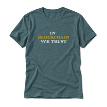 In Blockchain We Trust original artwork on a heather deep teal t-shirt, upright relaxed flatlay on pure white